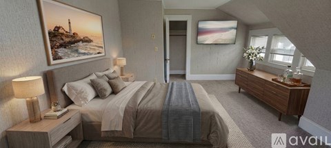 A bedroom with a large bed and a painting on the wall.