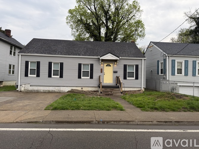 A house with a yellow door is for sale.