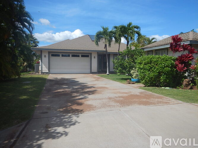 A house with a driveway and garage is for sale.