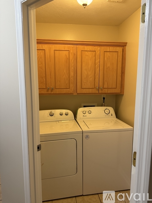 A small laundry room with a washer and dryer.