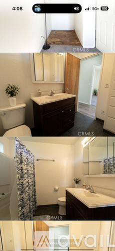A bathroom with a white sink and a mirror above it.