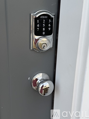 A keypad lock with numbers 1 to 9 and 0 displayed on a keypad.