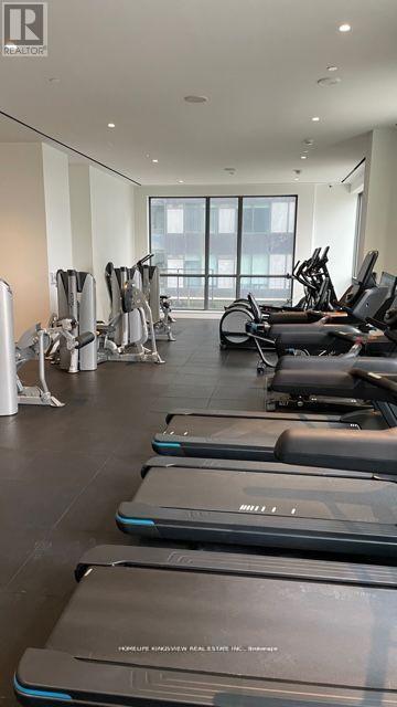 A gym with treadmills and exercise bikes.