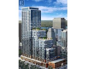 A tall building with a lot of windows is under construction.