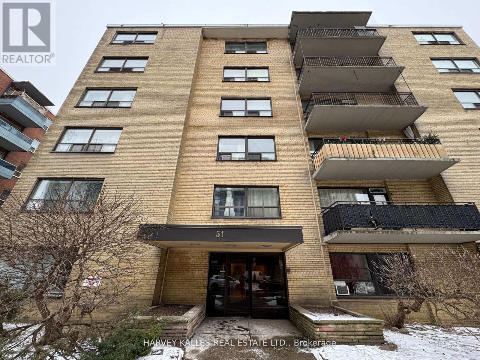 A tall apartment building with the number 51 on the front.