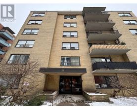 A tall apartment building with the number 51 on the front.