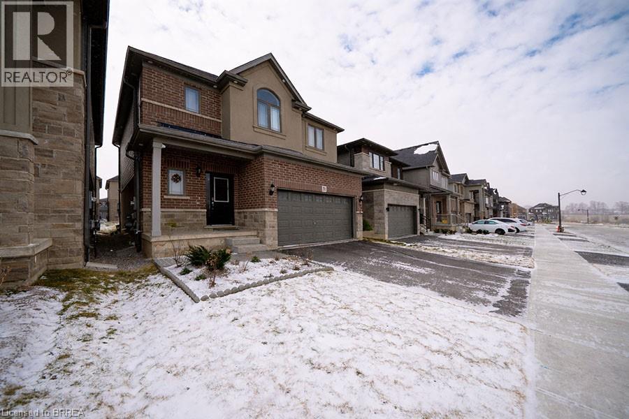 A row of houses with a realtor sign in the foreground.