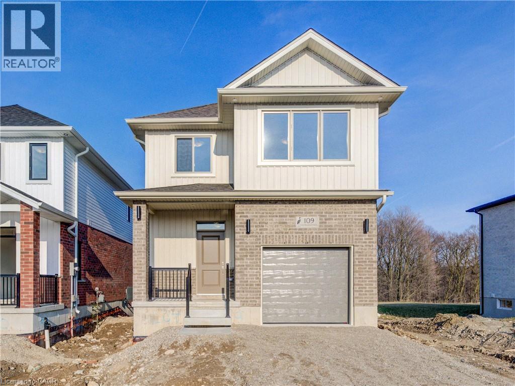 A two-story house with a garage is for sale.