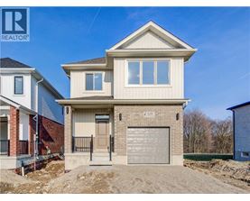 A two-story house with a garage is for sale.