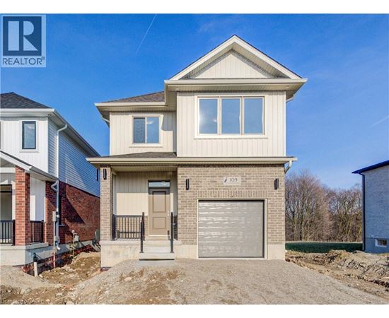 A two-story house with a garage is for sale.