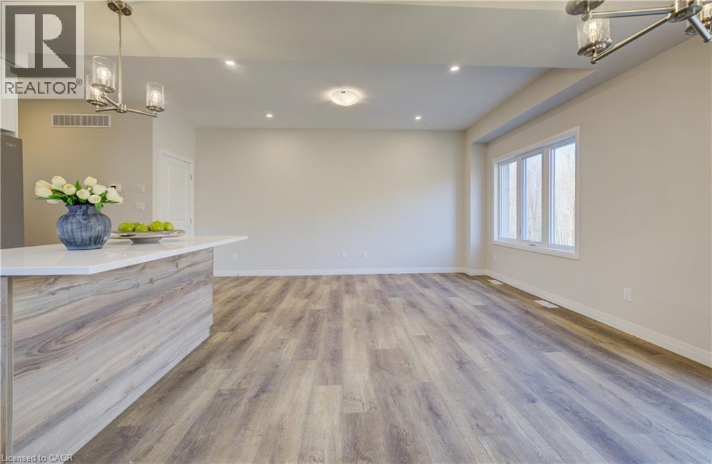 A realtor's office with a reception desk and a large open space.