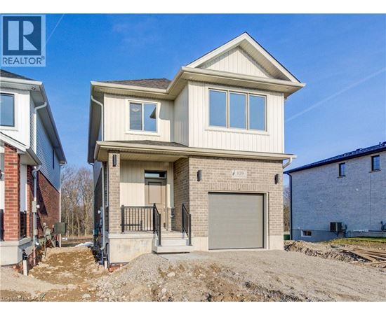 A two-story house with a garage is under construction.