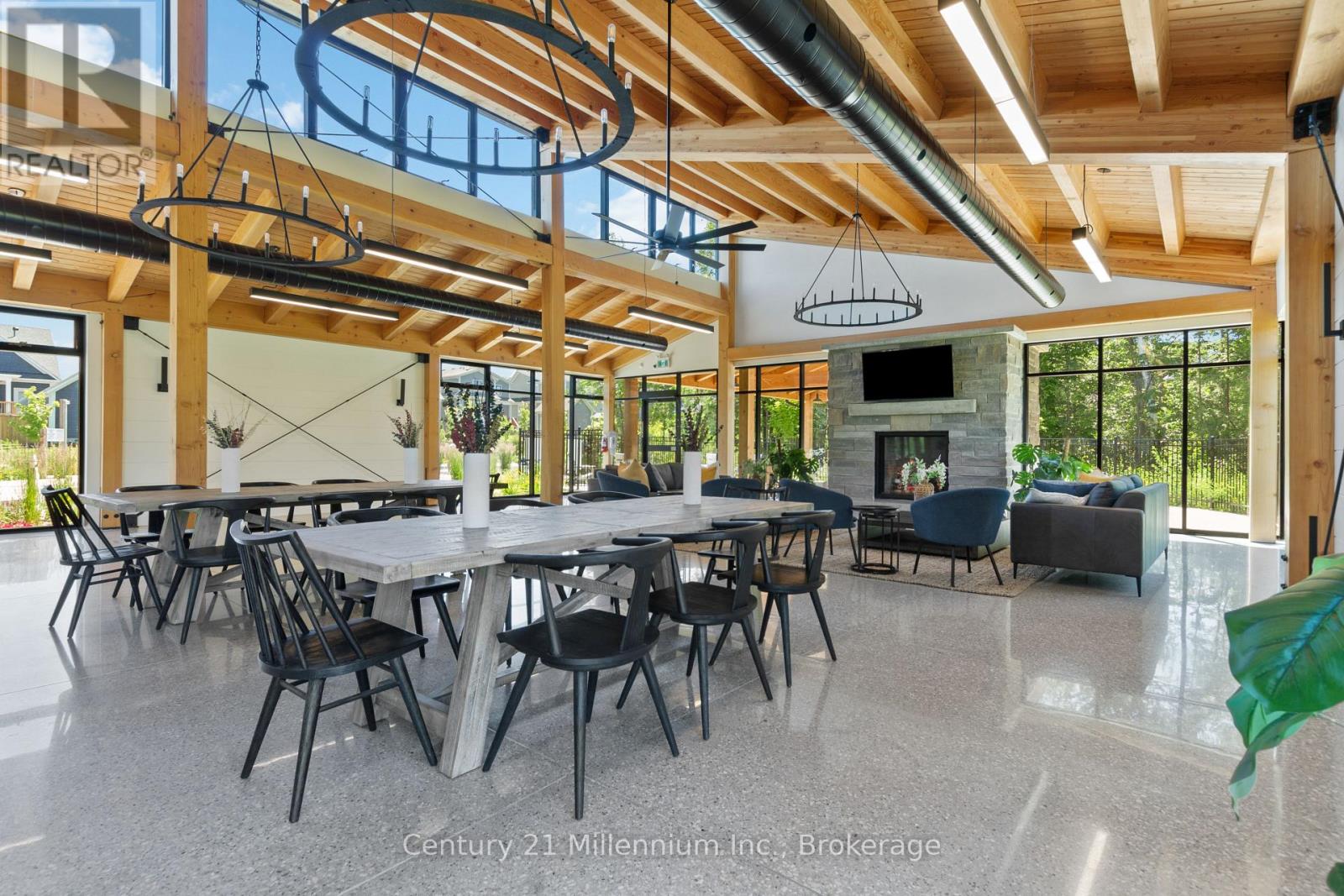 A spacious dining area with a long table and chairs.