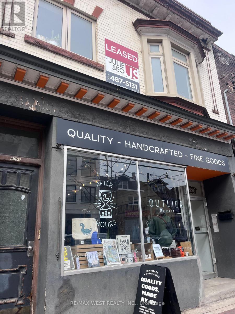 A storefront with a sign that reads "Quality Handcrafted Fine Goods".