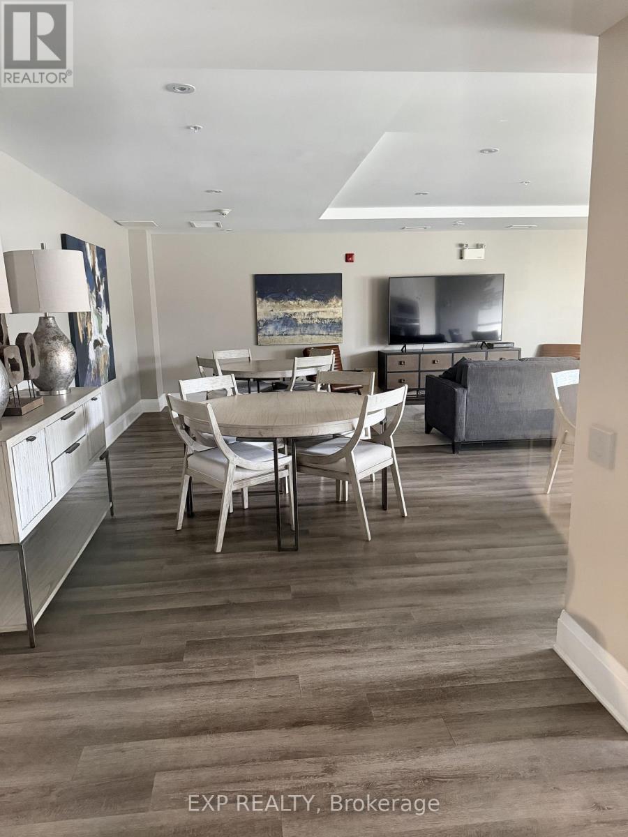 A dining room with a table and chairs.
