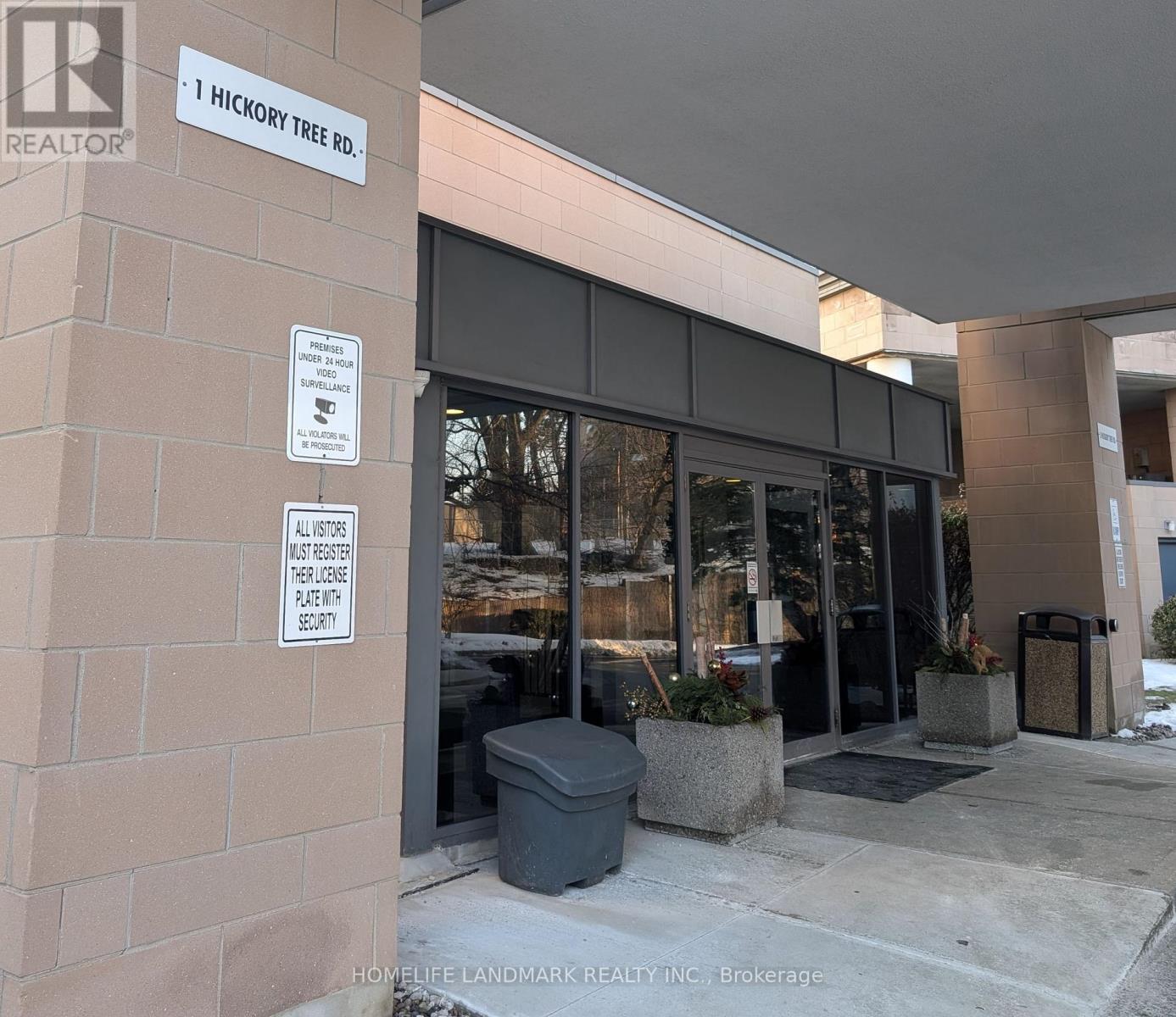 The front of a building with a sign that says "1 Hickory Tree Rd."