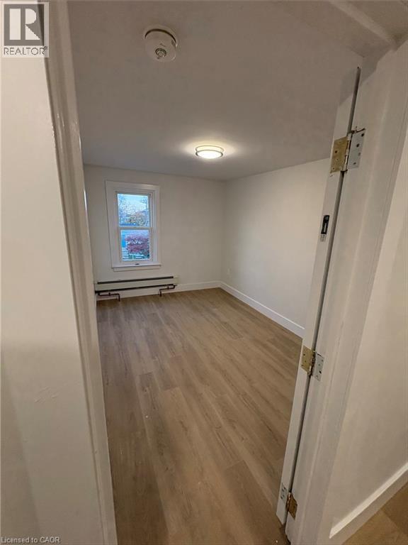 A room with a door and a window.