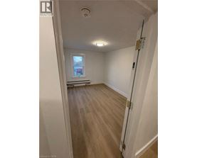 A room with a door and a window.