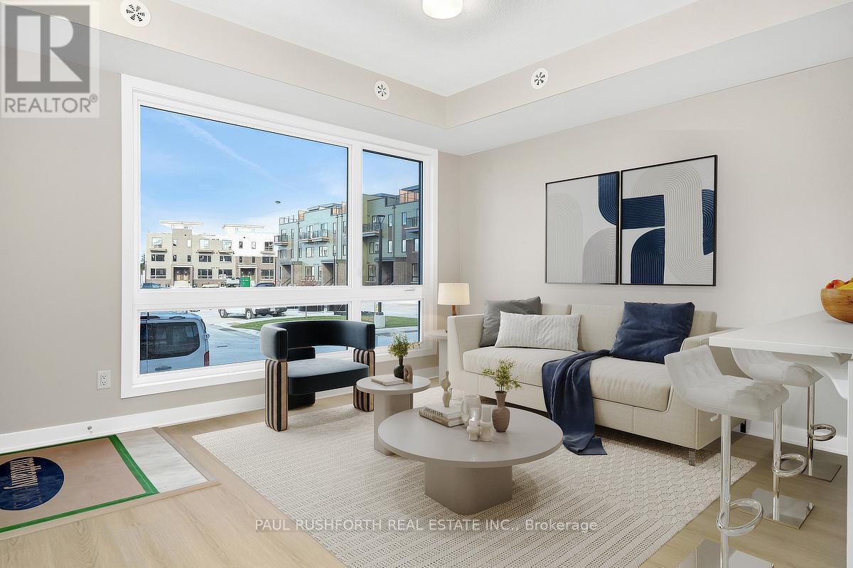 A modern living room with a view of the street outside.