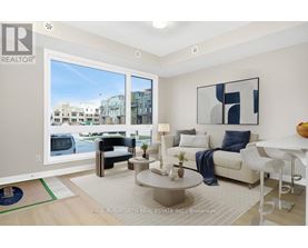 A modern living room with a view of the street outside.