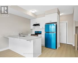 A kitchen with a white counter and a blue fridge.