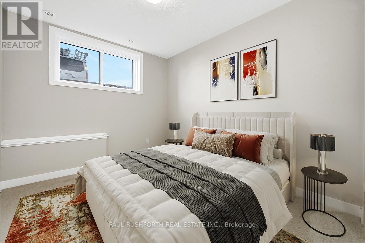 A bedroom with a large bed and a window.