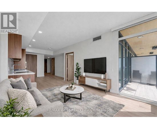 A modern living room with a grey sofa and a white coffee table.