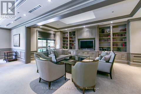 A living room with a large couch and a television.