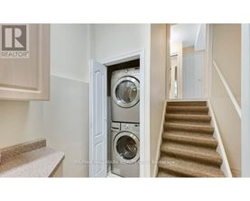 A washing machine is built into a wall in a home.