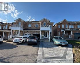 A row of houses with cars parked in front.