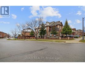 A real estate photo of a residential area with a house and trees.