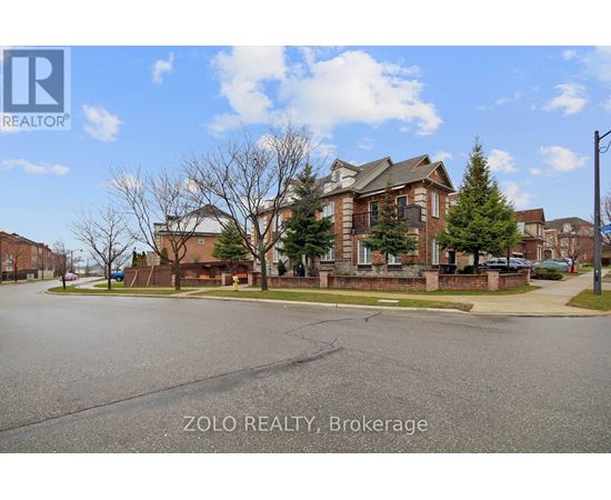 A real estate photo of a residential area with a house and trees.