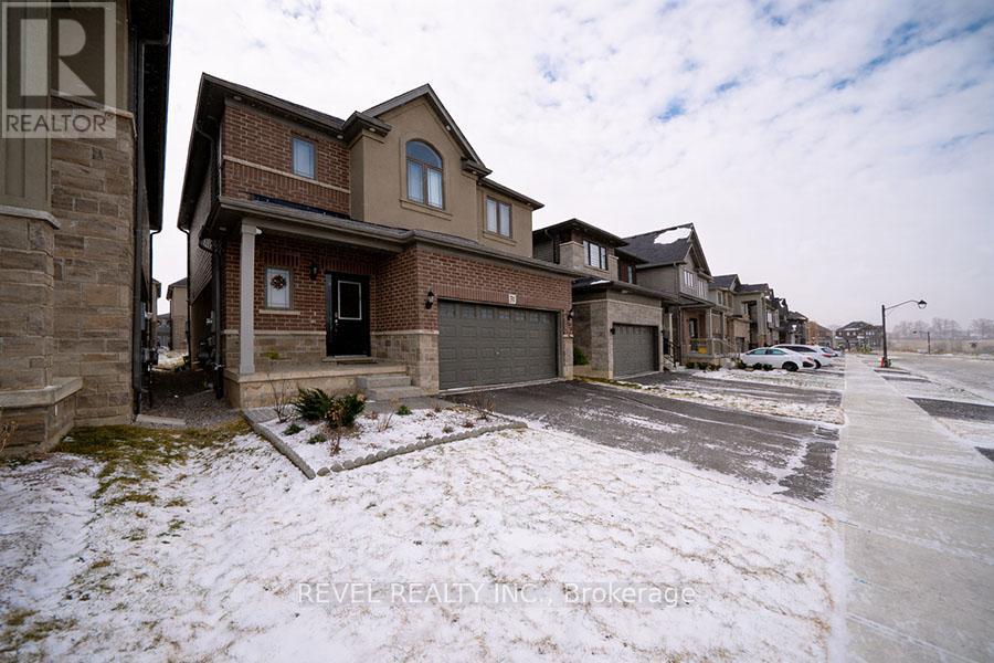 A row of houses with a realtor sign in the foreground.