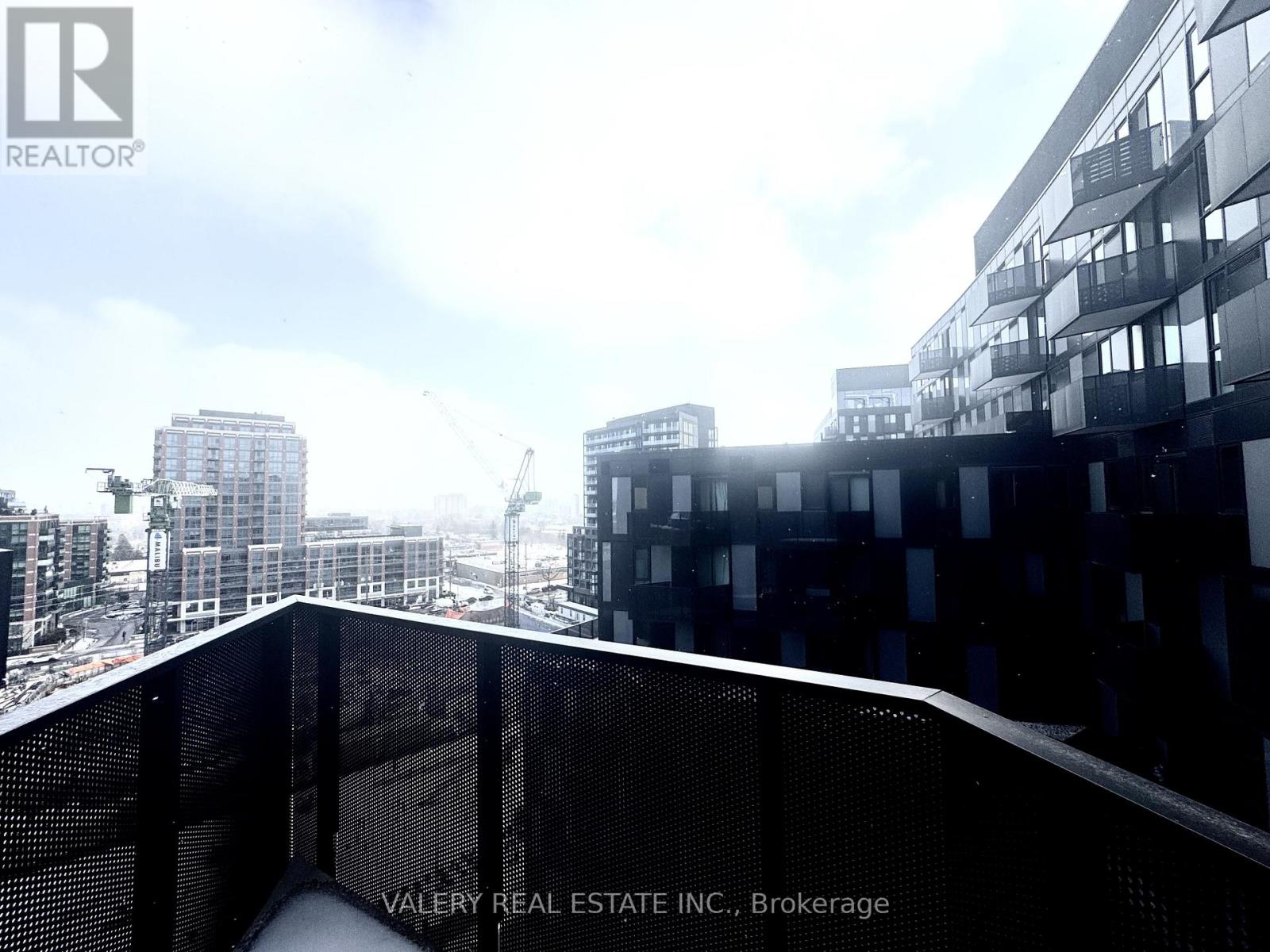 A view from a high-rise building looking down at a cityscape.