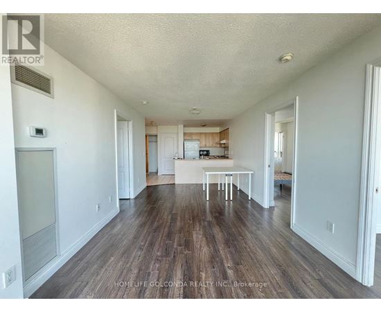 A room with wooden floors and white walls.