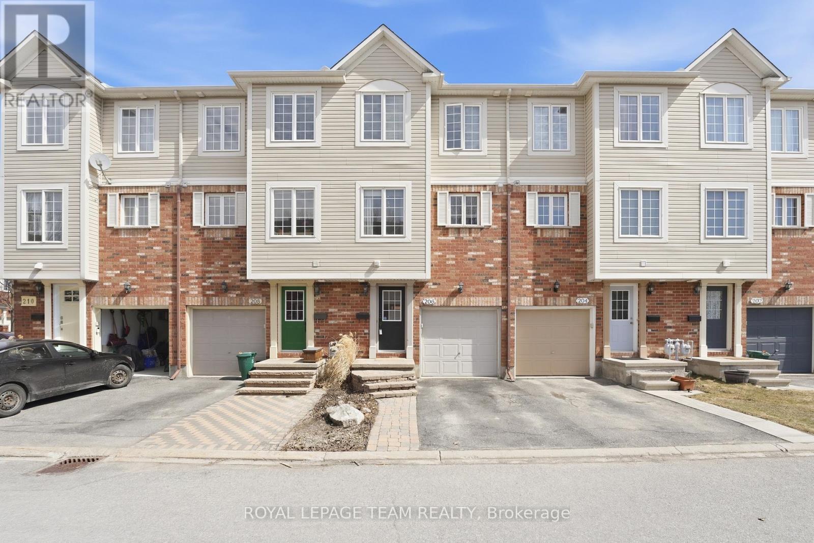 A building with the words "Royal LePage Team REALTY Brokerage" on the bottom.
