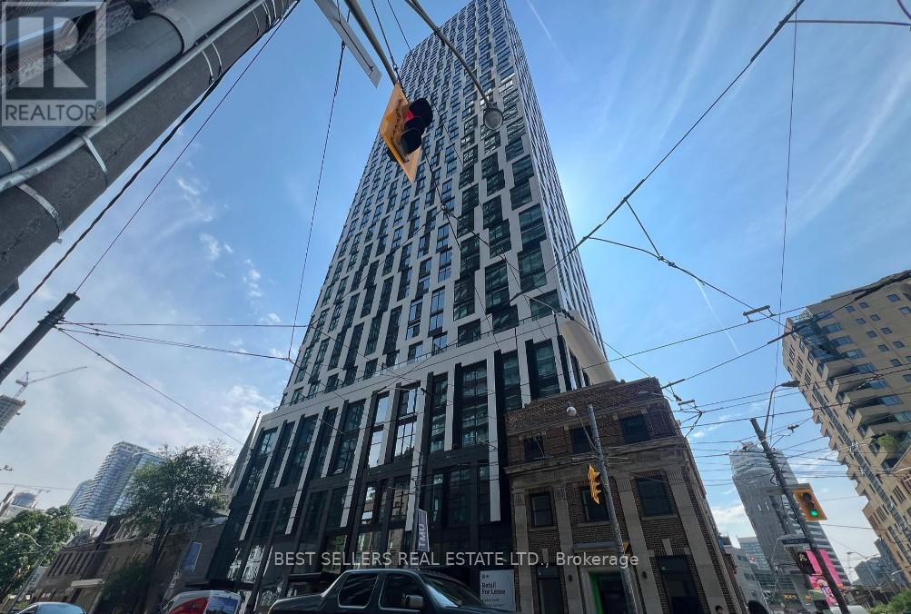 A tall building with the words "Best Sellers Real Estate Ltd." on it.