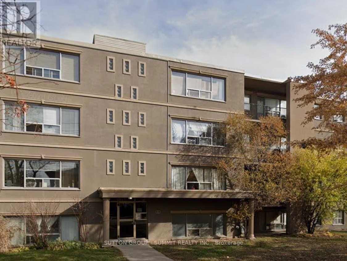 A multi-story residential building with a balcony on the second floor.