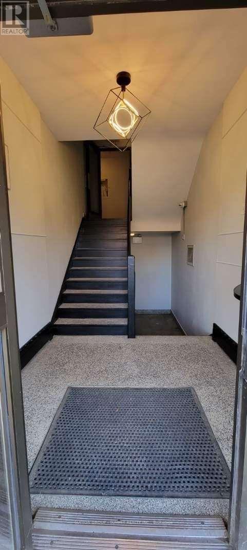A long hallway with a metal grate on the floor.