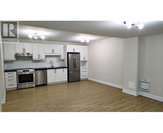 A kitchen with white cabinets and stainless steel appliances.
