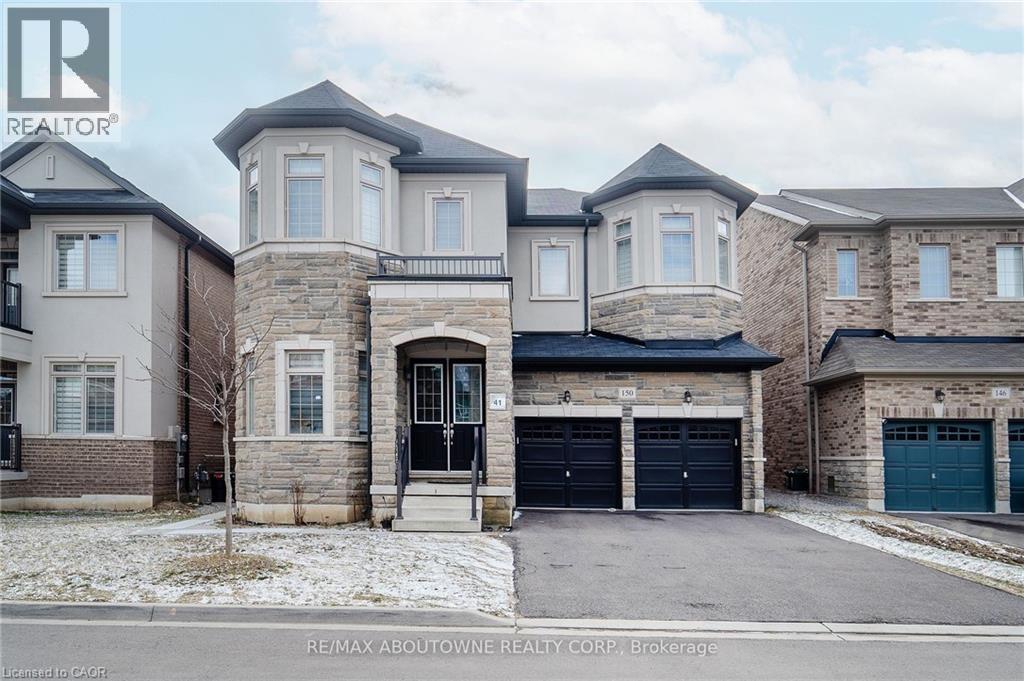 A large, two-story house with a stone facade and a black front door.