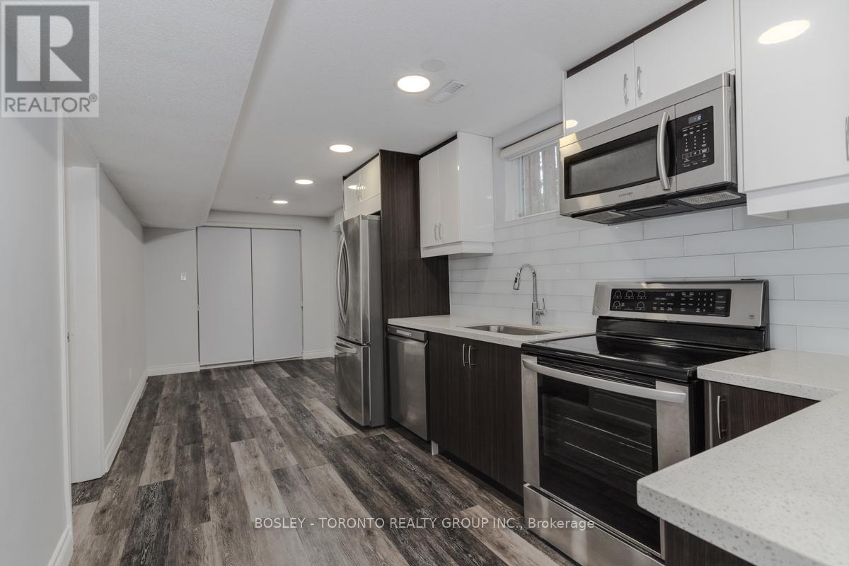A modern kitchen with a Bosley Toronto Realty Group Inc. logo.