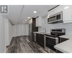 A modern kitchen with a Bosley Toronto Realty Group Inc. logo.