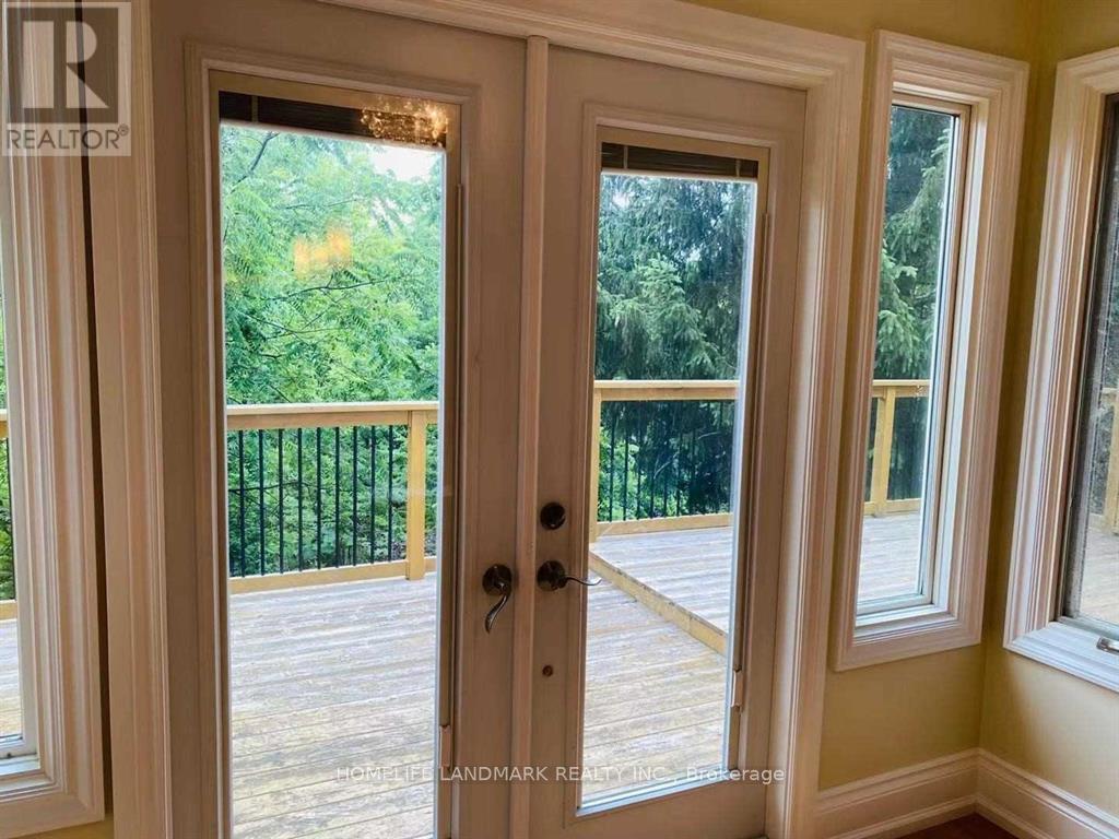 A white door with a glass window and a black handle.
