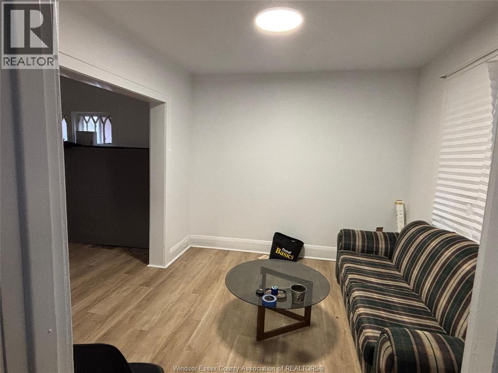 A living room with a striped couch and a coffee table.