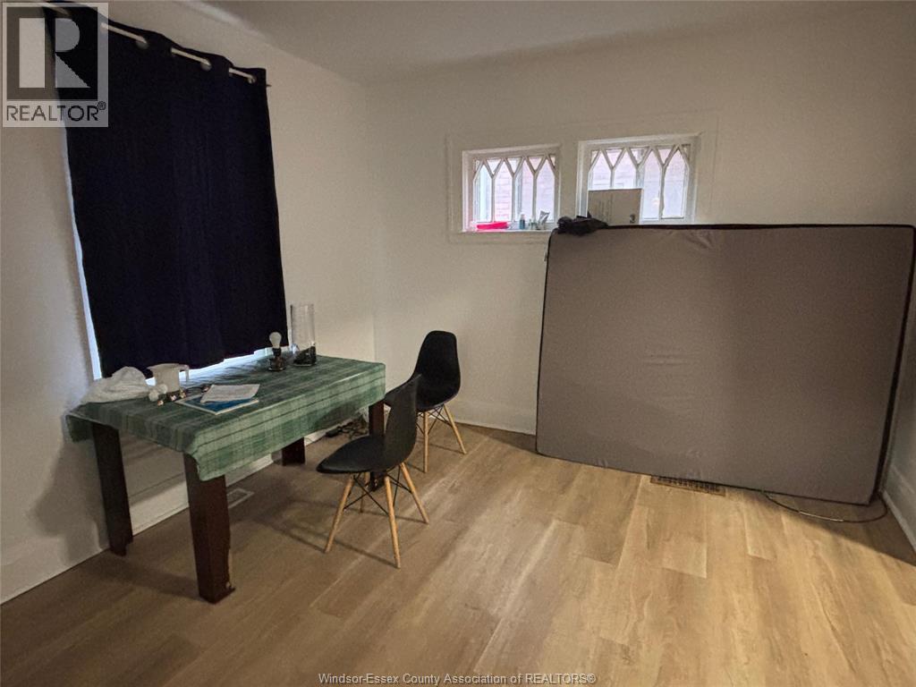 A room with a desk and chair in it.