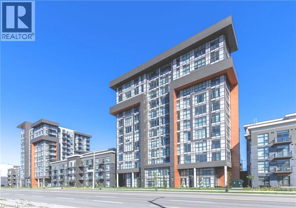 A modern multi-story residential building with a clear blue sky in the background.