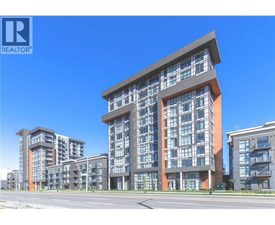 A modern multi-story residential building with a clear blue sky in the background.