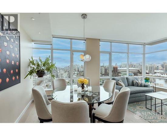 A dining room with a view of the city.