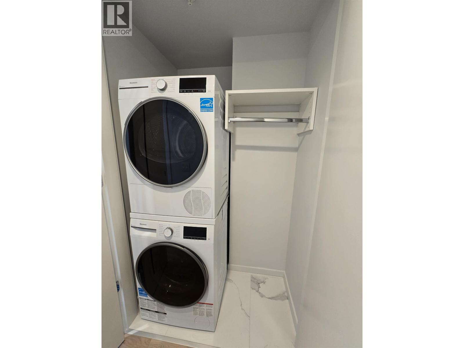 A washer and dryer in a small laundry room.